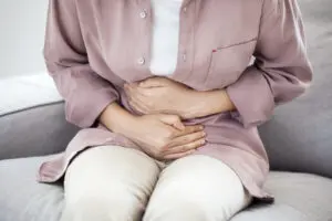 Young woman with stomach pain