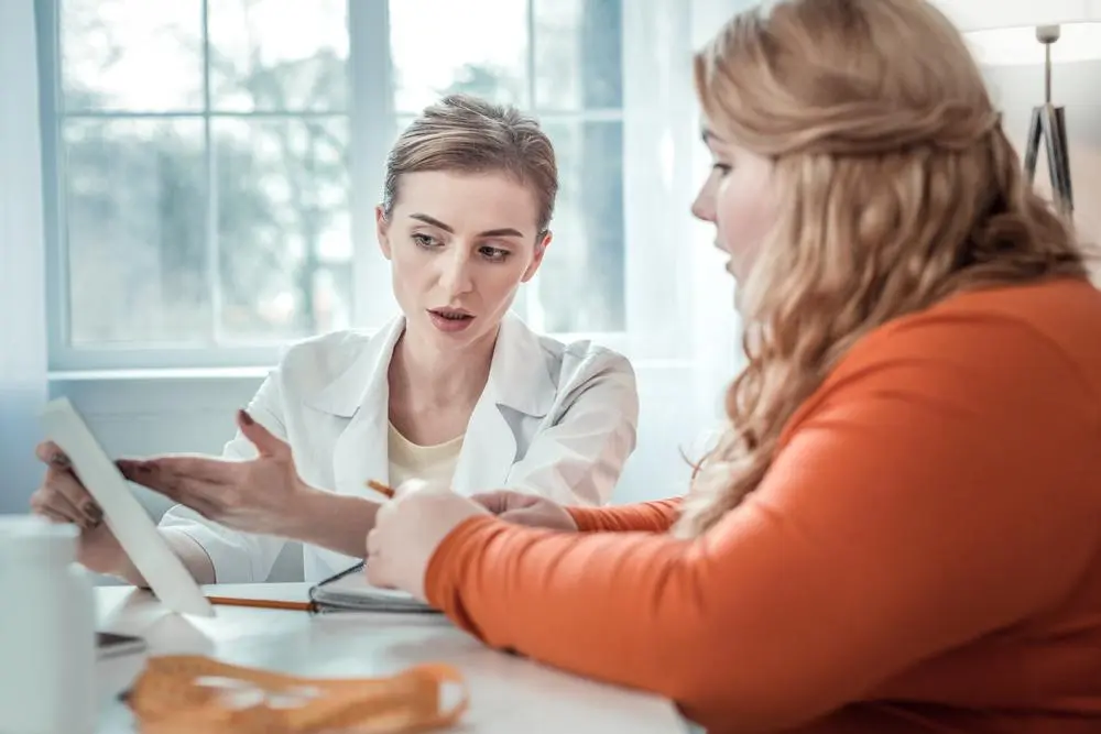 woman discussing bariatric surgery with her doctor