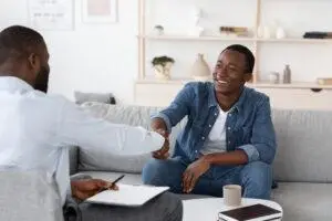 man shaking hands with his doctor